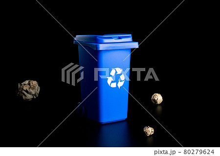Separation paper recycle. Blue dustbin for recycle paper trash isolated on black background. Bin container for disposal garbage waste and save environment. Separation paper recycle. Blue dustbin for recycle paper trash isolated on black background. Bin container for disposal garbage waste and save environment. 80279624