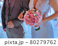 wedding couple holding a bouquet for the wedding 80279762