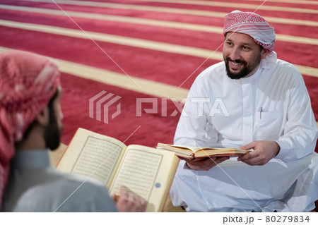 two muslim people in mosque reading quran together concept of islamic education two muslim people in mosque reading quran together concept of islamic education 80279834