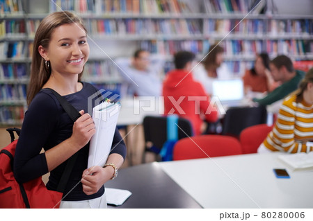 the student uses a notebook and a school library the student uses a notebook and a school library 80280006