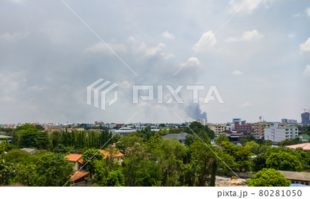 Long black smoke from a fire in the office building. Long black smoke from a fire in the office building. 80281050