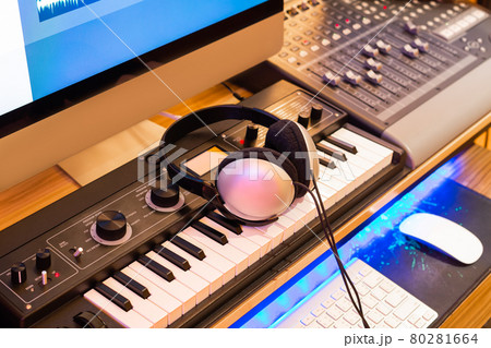 stereo headphone on keyboard synthesizer in home recording studio. music production equipment concept 80281664