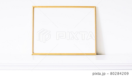Golden frame on white furniture, luxury home decor and design for mockup, poster print and printable art, online shop showcase 80284209