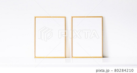 Golden frame on white furniture, luxury home decor and design for mockup, poster print and printable art, online shop showcase 80284210