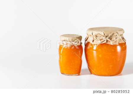 Delicious homemade jam in glass jars on a white background. 80285052