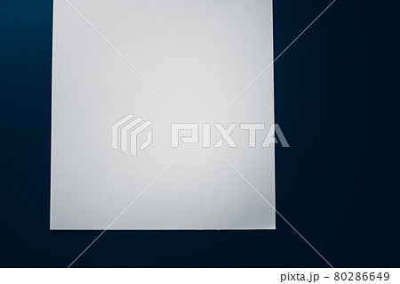 Blank A4 paper, white on blue background as office stationery flatlay, luxury branding flat lay and brand identity design for mockup 80286649