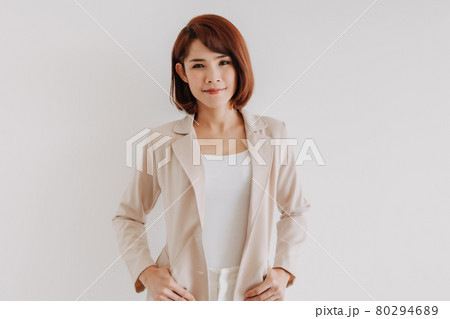 Office woman in white clothes and creamy casual suit on white background. 80294689