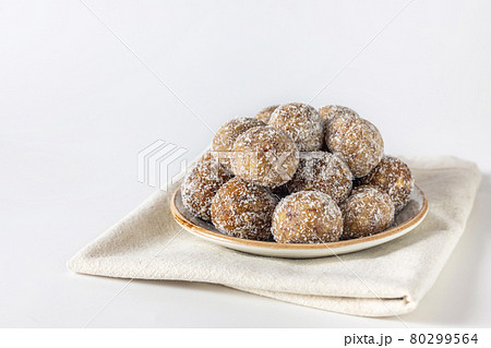 Healthy sweet food. Energy balls in a plate on a white background Healthy sweet food. Energy balls in a plate on a white background 80299564