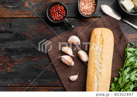Ingredients for sandwich with butter, herbs and baguette, on old dark wooden table background, top view flat lay, with copy space for text Ingredients for sandwich with butter, herbs and baguette, on old dark wooden table background, top view flat lay, with copy space for text 80302897