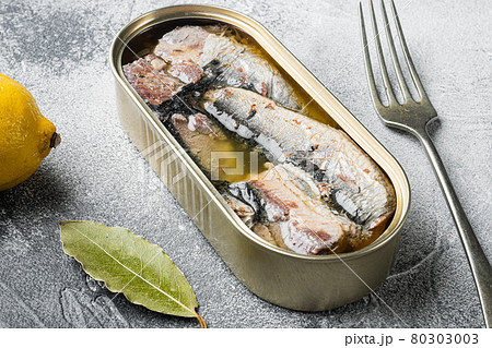 Can of sardines in olive oil, on gray stone table background 80303003