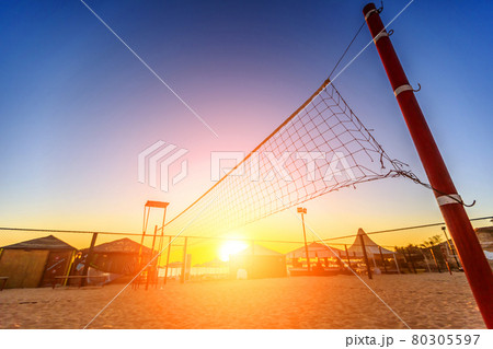 Sillhouette of a volleyball net and sunrise on the beach Sillhouette of a volleyball net and sunrise on the beach 80305597