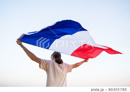French woman with a flag. Pride. Patriot goes with the national symbol of the country 80305780