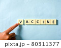 Children hand completing vaccine word on the puzzle 80311377