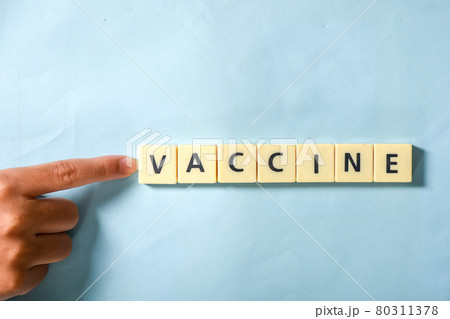 Children hand completing vaccine word on the puzzle Children hand completing vaccine word on the puzzle 80311378