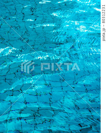 Reflection of sky on the moving water surface in the pool Reflection of sky on the moving water surface in the pool 80312231