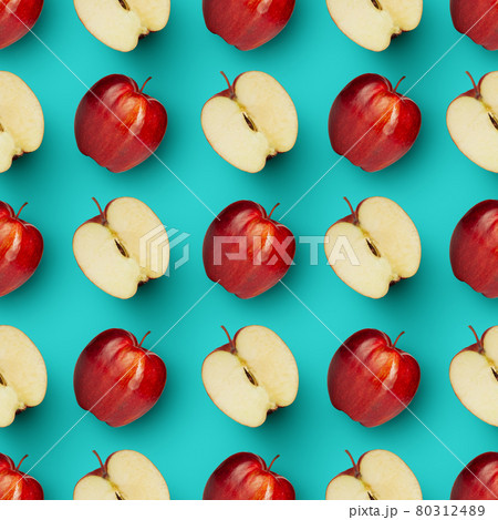 Halves and whole red juicy apples over bright blue background. Contemporary art collage. Halves and whole red juicy apples over bright blue background. Contemporary art collage. 80312489