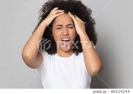 Unhealthy African American woman having severe headache Unhealthy African American woman having severe headache 80314244