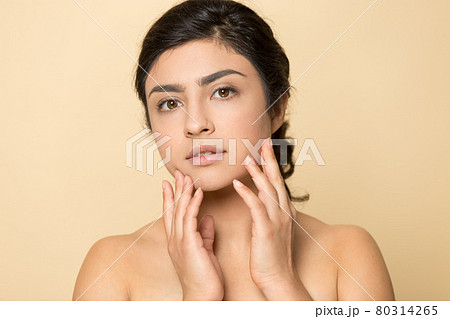 Portrait of Indian woman touch healthy face skin 80314265