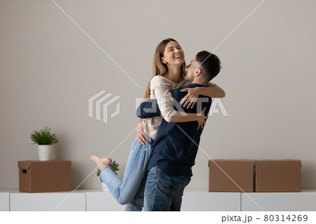 Happy couple renters celebrate relocation to new home Happy couple renters celebrate relocation to new home 80314269