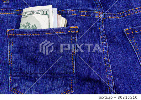 US dollars banknotes in the pocket of blue jeans 80315510