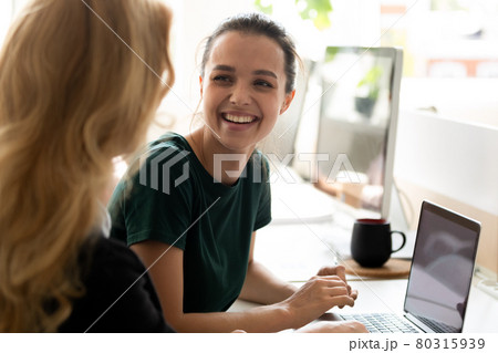 Happy millennial intern, student girl talking to teacher, consulting tutor, 80315939