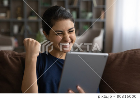 Excited Indian woman triumph with good news on cell 80316000