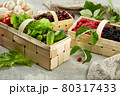 Harvest vegetables in wooden basket on light background 80317433