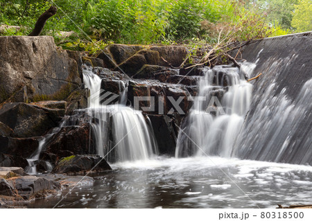 waterfall creek in the rocks mountain long exposure of clear running water  80318500