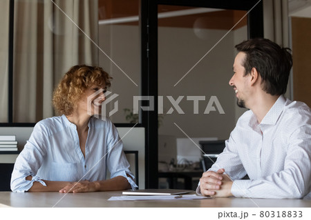 Happy business partners colleagues negotiating at meeting in office 80318833