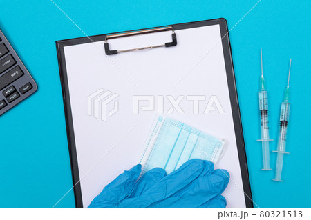 Vaccination or Revaccination Concept - Two Medical Syringe on Blue Table 80321513