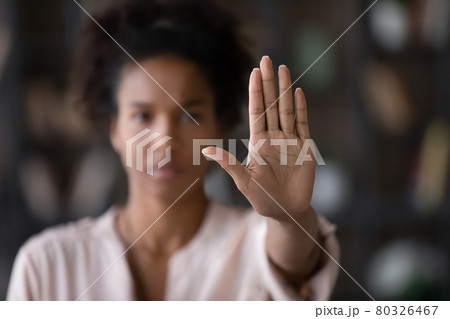 Close up African American woman showing stop gesture with hand 80326467