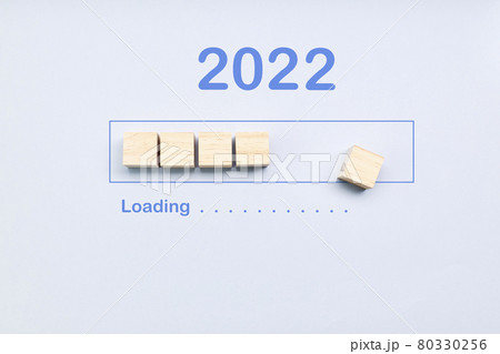 Loading 2022 year on cubes on a blue background. New Year concept Loading 2022 year on cubes on a blue background. New Year concept 80330256