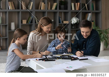 Happy family with kids drawing at home together 80330527