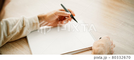 Banner with man hands writing in a blank notebook Banner with man hands writing in a blank notebook 80332670
