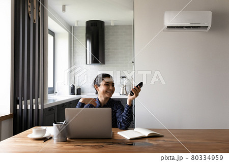 Happy female Indian student or employee working from home Happy female Indian student or employee working from home 80334959