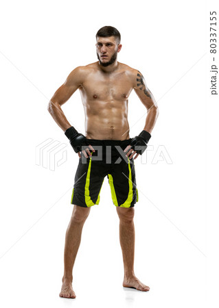Full-length portrait of Caucasian athlete, professional male MMA boxer isolated on white studio background. Sport, competition and human emotions concept. 80337155