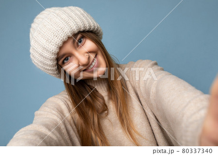 Closeup photo of beautiful happy smiling young dark blonde woman standing isolated over colourful Closeup photo of beautiful happy smiling young dark blonde woman standing isolated over colourful 80337340