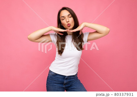 Portrait photo of young happy positive beautiful brunette woman with sincere emotions wearing casual 80337931