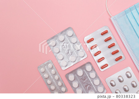 Different Pills and Tablets Package on Pink Background Different Pills and Tablets Package on Pink Background 80338323