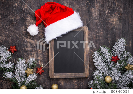 Christmas dark background with Santa hat 80340032