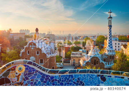 Barcelona city view from Guell Park. Sunrise view of colorful mosaic building in Park Guell 80340074