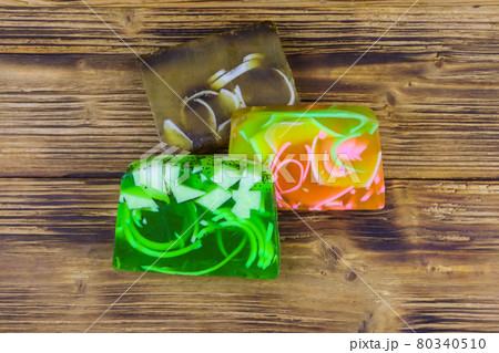 Set of handmade soap bars on wooden background. Top view 80340510