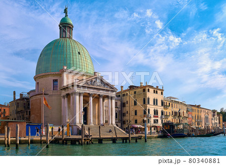 Beautiful church of San Simeone Piccolo on Grand Canal, Venice, Italy, daylight, blue sky, soft clouds, landmark of waterway, UNESCO world heritage Beautiful church of San Simeone Piccolo on Grand Canal, Venice, Italy, daylight, blue sky, soft clouds, landmark of waterway, UNESCO world heritage 80340881