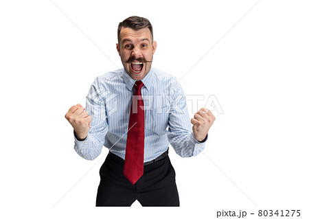 Win, success. Portrait of young businessman, office worker, manager isolated over white studio background. 80341275