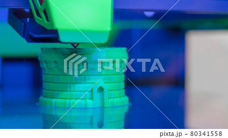 3D printing machine printing plastic model at factory, exhibition - close up 3D printing machine printing plastic model at factory, exhibition - close up 80341558