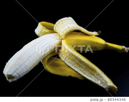 Yellow bananas on a black background. Yellow bananas on a black background. 80344346
