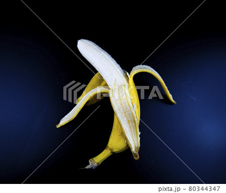 Yellow bananas on a black background. Yellow bananas on a black background. 80344347