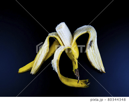 Yellow bananas on a black background. 80344348