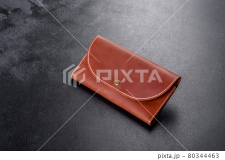 Beautiful leather brown purse made of leather to store paper money 80344463