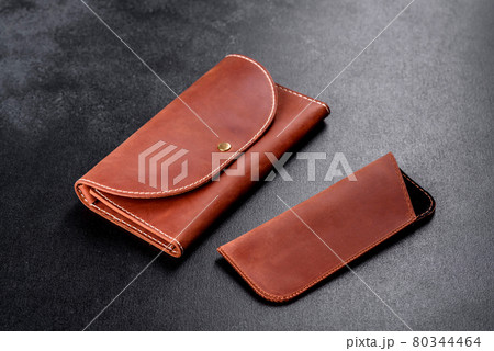 Beautiful leather brown purse made of leather to store paper money Beautiful leather brown purse made of leather to store paper money 80344464